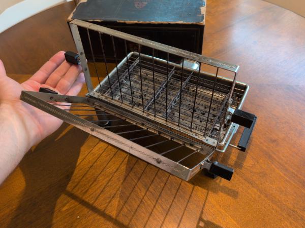 The bread cage, lifted and opened