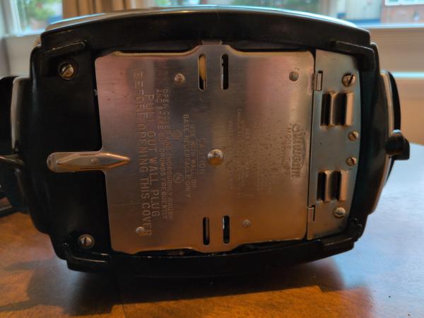 Bottom view, the adjustment screw can be observed in the center